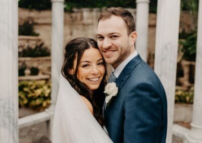 Beautiful bride and groom smiling at Zolana Weddings wedding setting.
