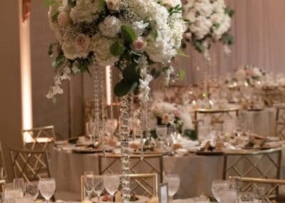 Elegant wedding table setup with luxurious flowers and crystal centerpieces for a romantic reception.