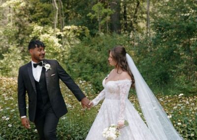 Brides and grooms during wedding in scenic forest setting.